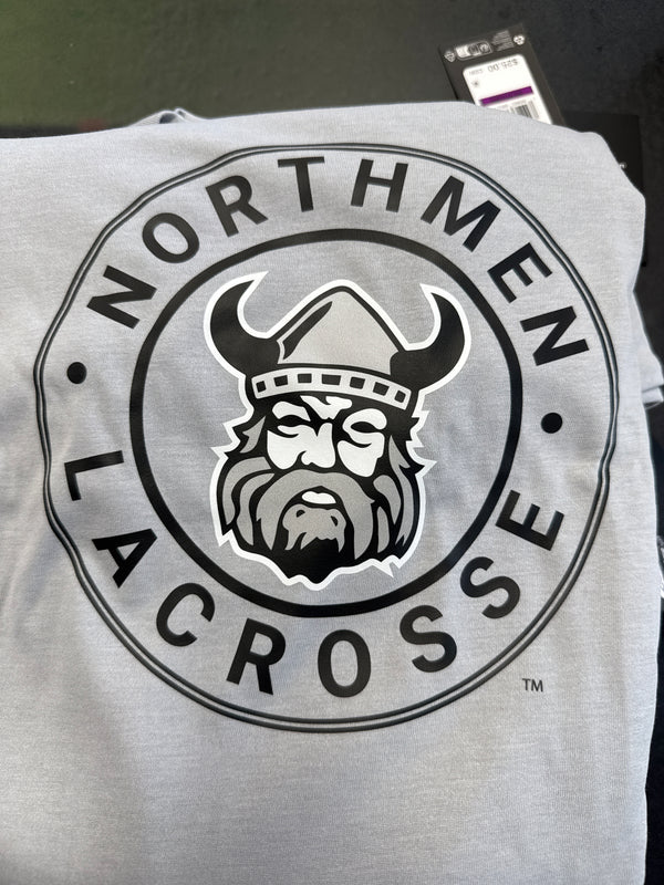 The Large Circle Northmen Logo T-shirts by Sanderson Lacrosse feature “NORTHMEN LACROSSE” around a Viking helmet and beard. Available at your favorite Canadian lacrosse shop.