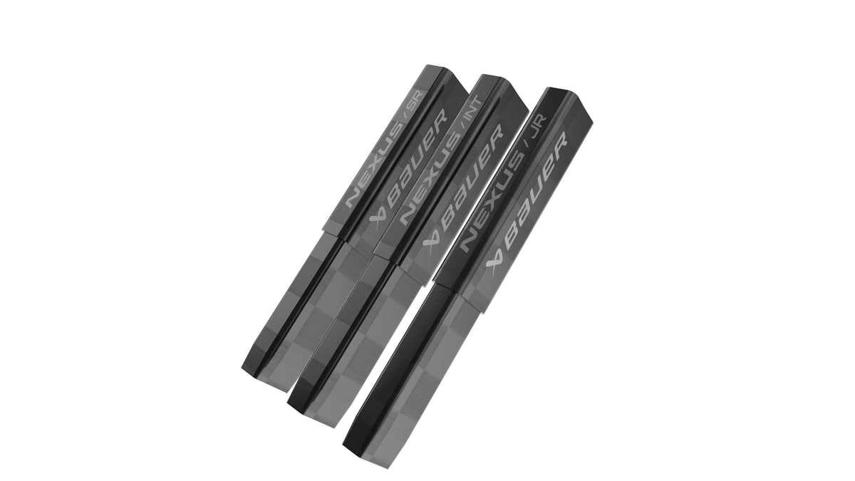 Three black rectangular Bauer Nexus 4" End Plugs, each labeled BAUER, are arranged diagonally on a white background with tops aligned and bottoms slightly offset.