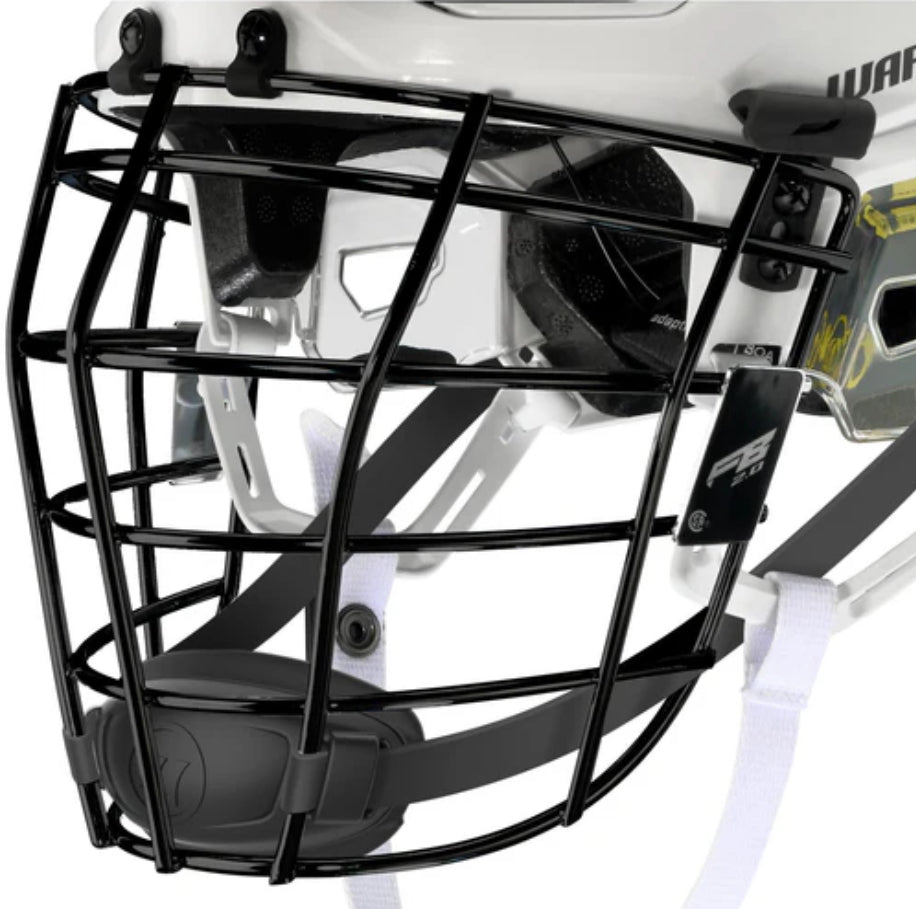 Close-up of a black Warrior Fatboy 2.0 Face Mask FB2 attached to a white Warrior helmet, showing chin strap and padding. Made by Warrior, this facemask offers protection for high-intensity sports like lacrosse or hockey.
