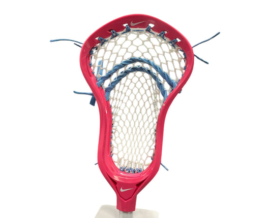 An upright Nike L4 Pink Lacrosse Head, pre-strung with StringKing Type 5S Mesh and blue strings for enhanced ball control, is shown close-up against a white background.