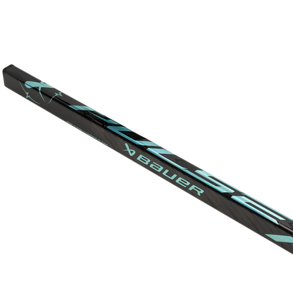 Close-up of the Bauer Pulse Hockey Stick by Bauer, highlighting its TeXtreme carbon fiber construction and light blue graphics on a plain white background.