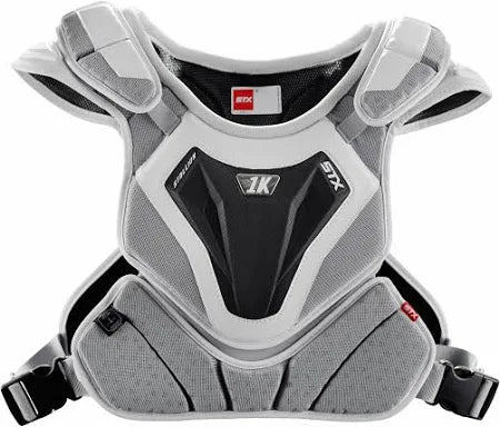The STX Stallion 1K Lacrosse Shoulder Pad features contoured gray and black padding, padded shoulders and sides, adjustable straps, central STX logo, and breathable mesh for comfort and protection from impact-related heart injuries.