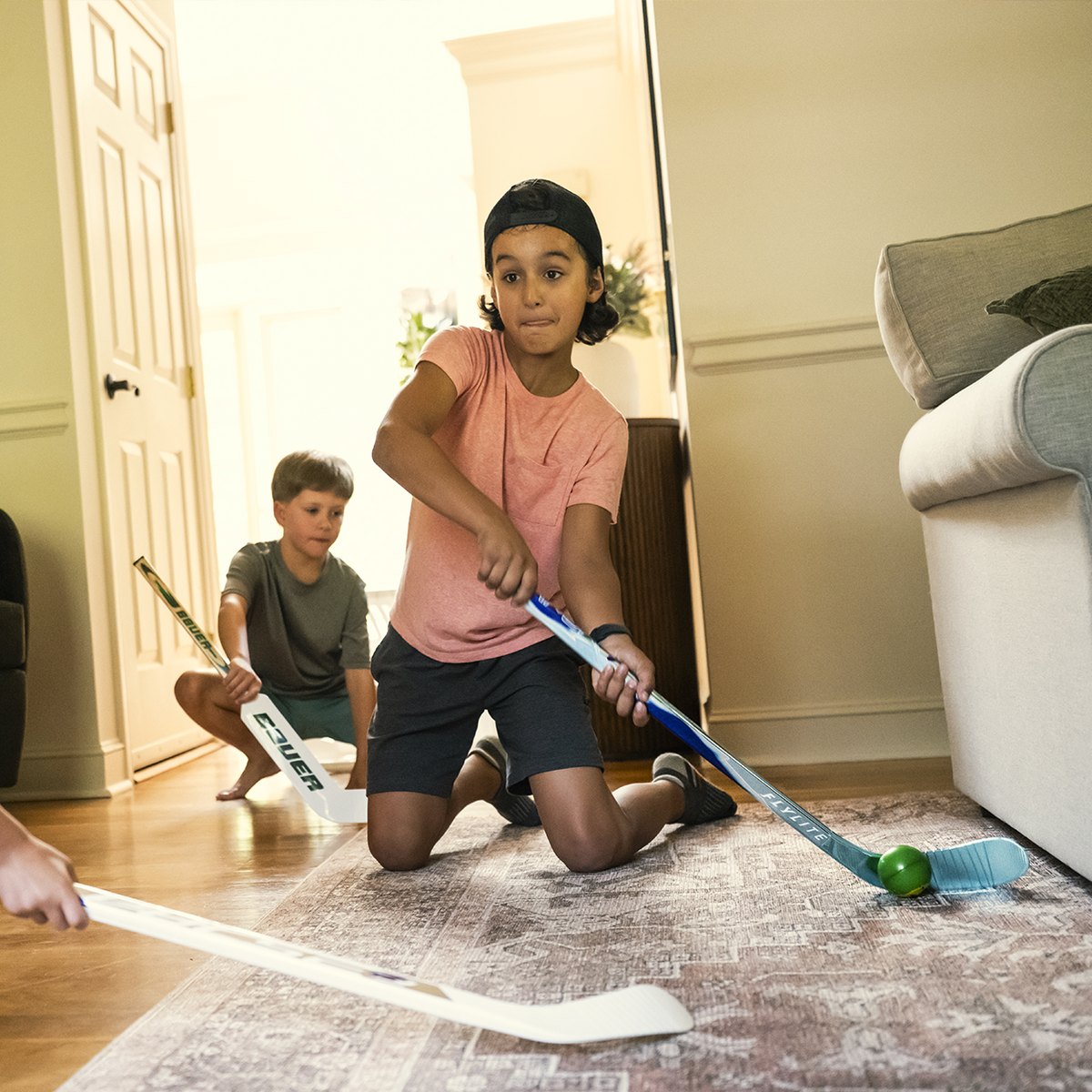 Bauer Mystery Minis 2026 mini hockey stick – kids playing knee hockey at home – Sanderson Lacrosse