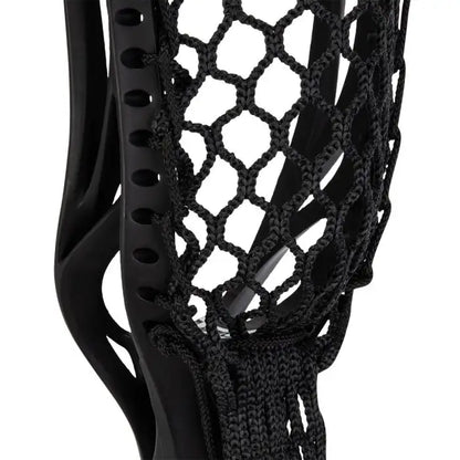 Close-up of a black brine edge lacrosse head with mesh design on a white background