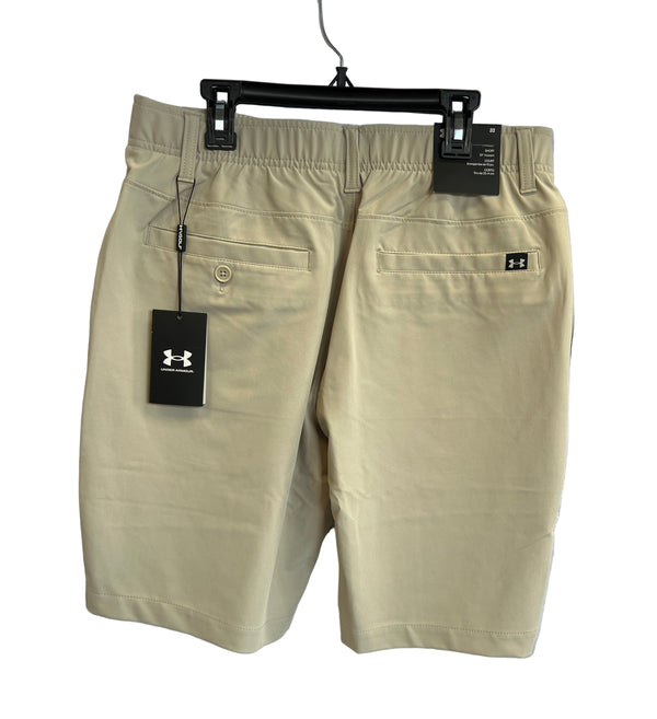 Northmen Lacrosse Under Armour Golf Shorts - Sand by Sanderson Lacrosse, shown hanging to display two back pockets and an Under Armour logo tag. Ideal for Canadian lacrosse fans—tags attached.