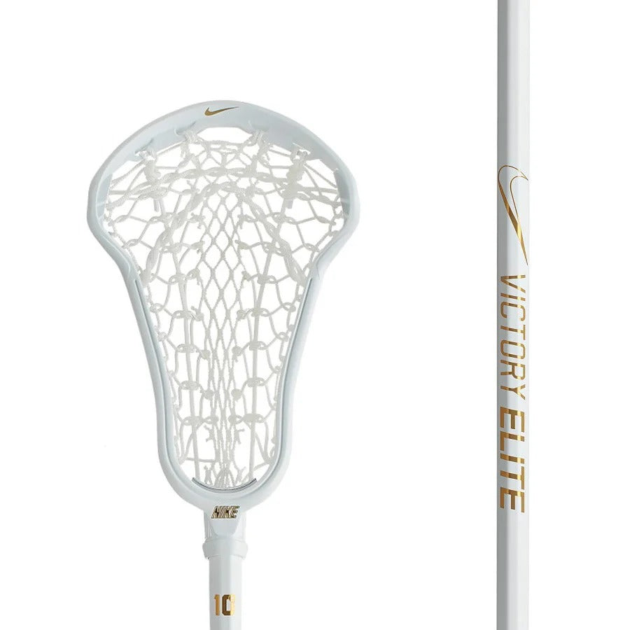 The Nike Victory Elite Complete Women’s Lacrosse Stick features a lightweight white design with a white net, gold Nike swoosh, VICTORY ELITE on the shaft, and is crafted for precision passing.