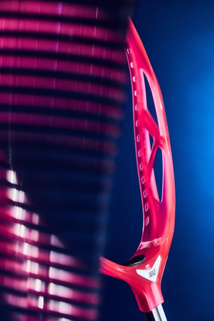Nike Prime Elite goalie head in limited edition Hyperpink on a blue studio background