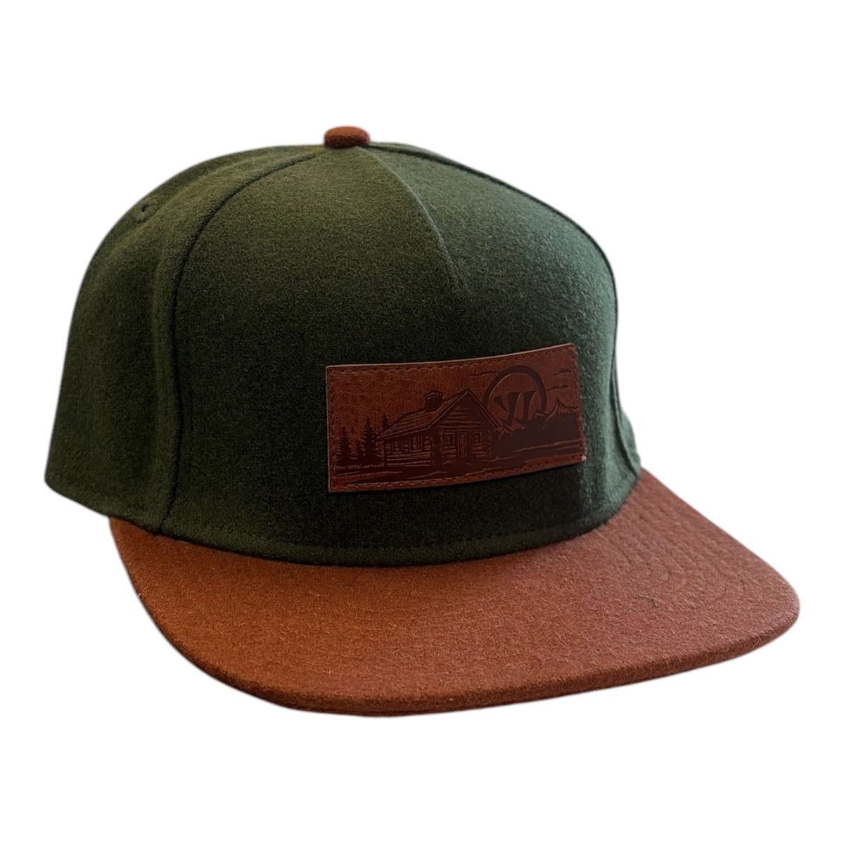 Warrior Novium Cabin Fever Wool Cap in forest green with brown flat brim and cabin patch